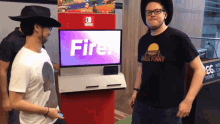 a man wearing a cowboy hat stands in front of a switch display