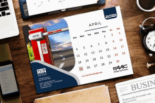 a calendar for the month of april is displayed on a desk