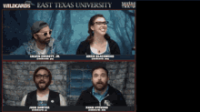 a group of people are sitting in front of a brick wall with the words east texas university on the top