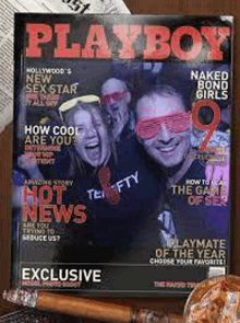 a playboy magazine with a man and a woman on the cover .