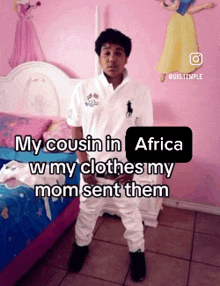 a boy standing in front of a bed with a caption that says my cousin in africa