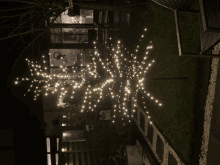 a bunch of lights are hanging from a fence