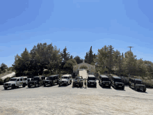 a row of jeep 's are parked in front of a church