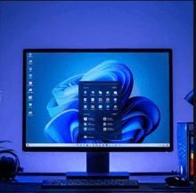 a computer monitor displays a blue screen with icons on it