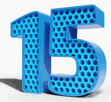 a blue number 15 with a pattern of hexagons on it