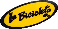 a yellow sign that says la bicicleta in black letters