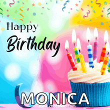 a cupcake with candles and the name monica on it