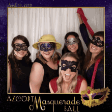 a group of women are posing for a photo in a photo booth with azcopt masquerade ball written on the bottom