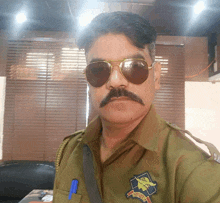 a man with a mustache wearing sunglasses and a badge that says ' passport '