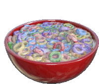 a red bowl filled with colorful cereal rings