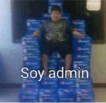 a boy is sitting on top of a pile of pepsi bottles .