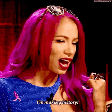 a woman with pink hair is saying i 'm making history