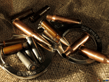 a pair of handcuffs surrounded by bullets and a badge that says sao juwanju