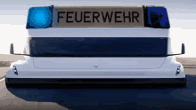 a white truck with a sign that says feuerwehr