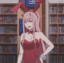 a girl wearing bunny ears is standing in front of a bookshelf