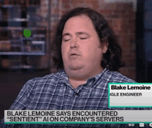 a man with the name blake lemoine on his shirt