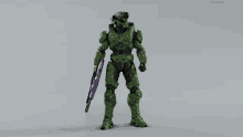 a green armored figure holding a purple weapon