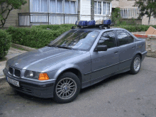 a gray car with a license plate that says k30 pdc