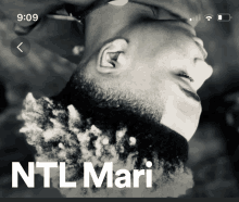 a black and white photo of a man with the name ntl mari on it