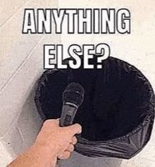 a person is holding a microphone in front of a trash can with the words `` anything else ? ''