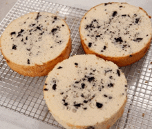 three slices of cake on a cooling rack with crumbs on them