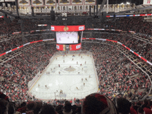 a hockey game is being played in a stadium with the number 72 on the back