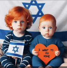 two baby boys holding a sign that says i want to go home