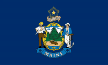 a maine state flag with a coat of arms on a blue background