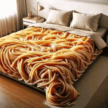 a bed with a blanket that is shaped like spaghetti