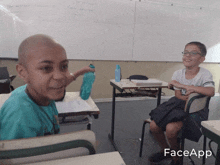 two boys are sitting at desks in front of a whiteboard with the word faceapp on it