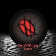 a black ball with a red circle and the words eye of woden batmatt