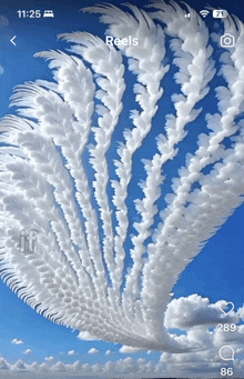 a phone screen shows a picture of white clouds and says reels at the top