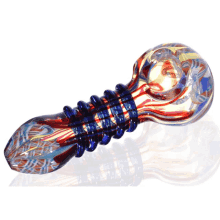 a red white and blue glass pipe is on a white surface