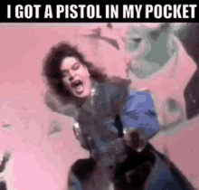 a woman is holding a gun in her pocket and yelling .