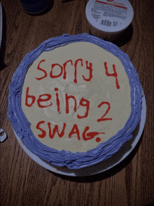 a cake that has the words sorry 4 being 2 swag written on it