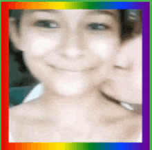 a blurry picture of a woman with a rainbow border