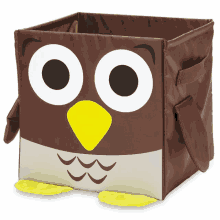 a brown box with an owl face and yellow beak