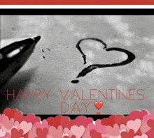 a black and white photo of a pen drawing a heart with the words happy valentines day