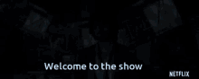 a man in a suit says welcome to the show in front of a netflix logo