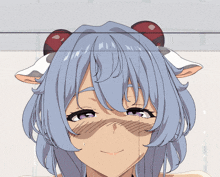 a close up of a girl 's face with blue hair and red ears