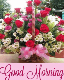 a bouquet of flowers in a basket with the words " good morning "