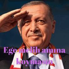 a man with a scarf around his neck salutes with the words ege melih amina koymasn written below him