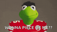 kermit the frog is wearing a red jersey with the number 5 on it