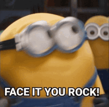 a close up of a minion wearing goggles with the words `` face it you rock '' written on it .