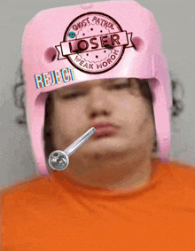 a person with a pink helmet that says loser on it