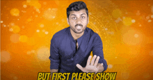 a man in a blue shirt stands in front of an orange background and says " but first please show "