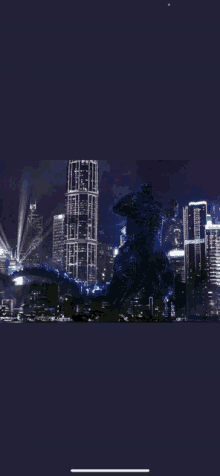 a picture of a monster in front of a city at night