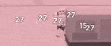 a blurred image of a person holding a gun with the numbers 27 and 1527 visible .