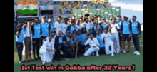 a group of people posing for a picture with the caption 1st test win in gabba after 32 years !