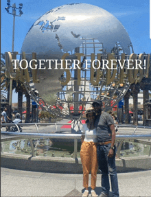 a couple standing in front of a globe with the words together forever above them